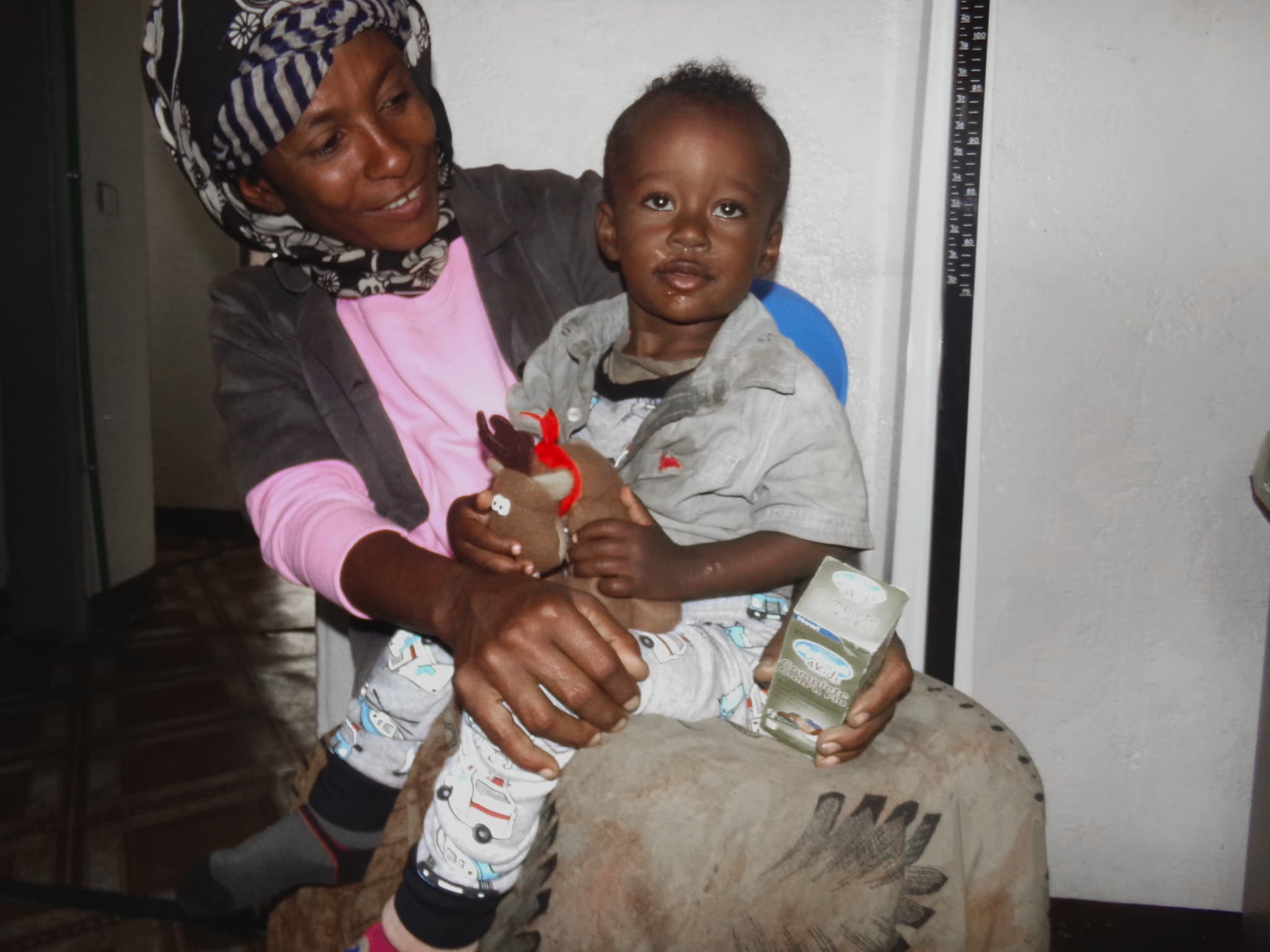 Young boy and mother receiving treatment at the clinic